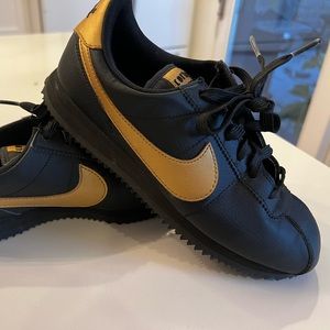 Nike Cortez size Y6.5 black and gold